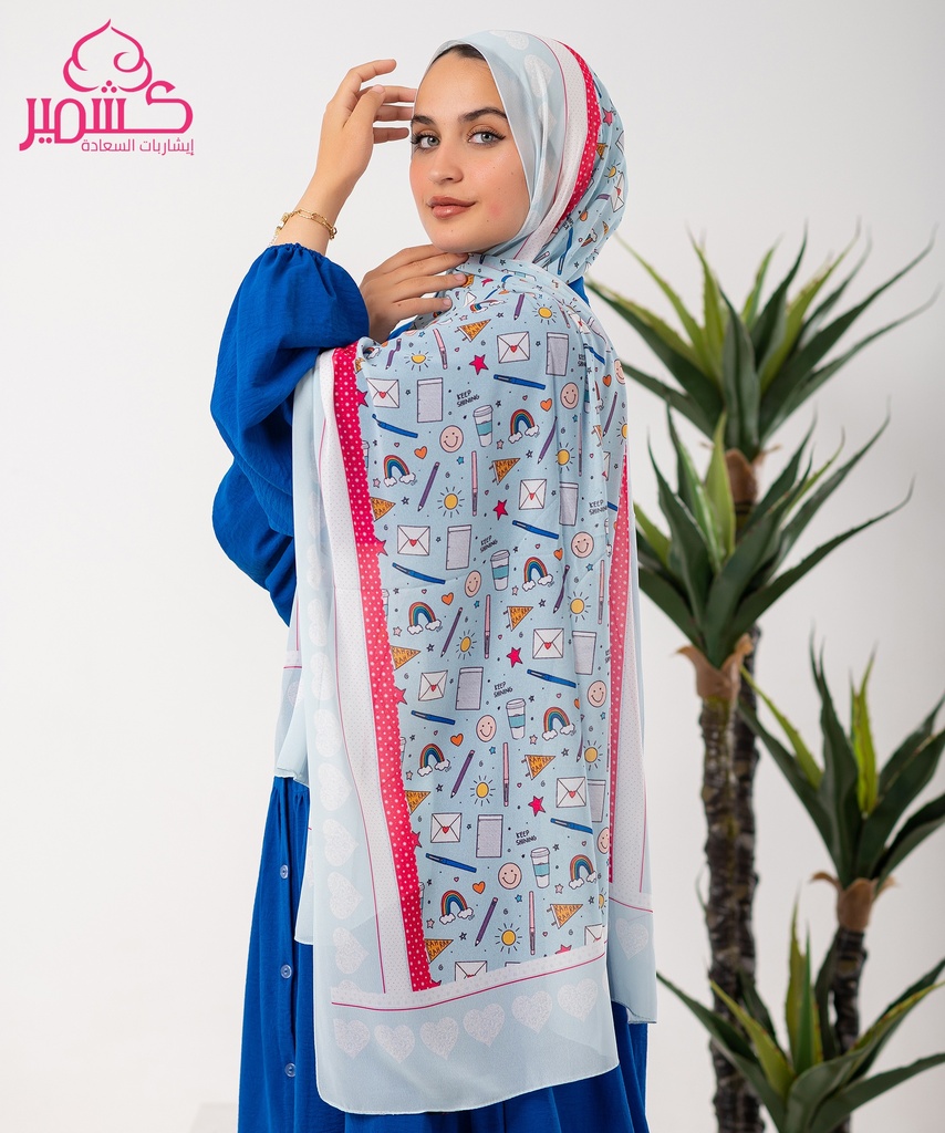 Light blue scarf with a variety of printed designs.