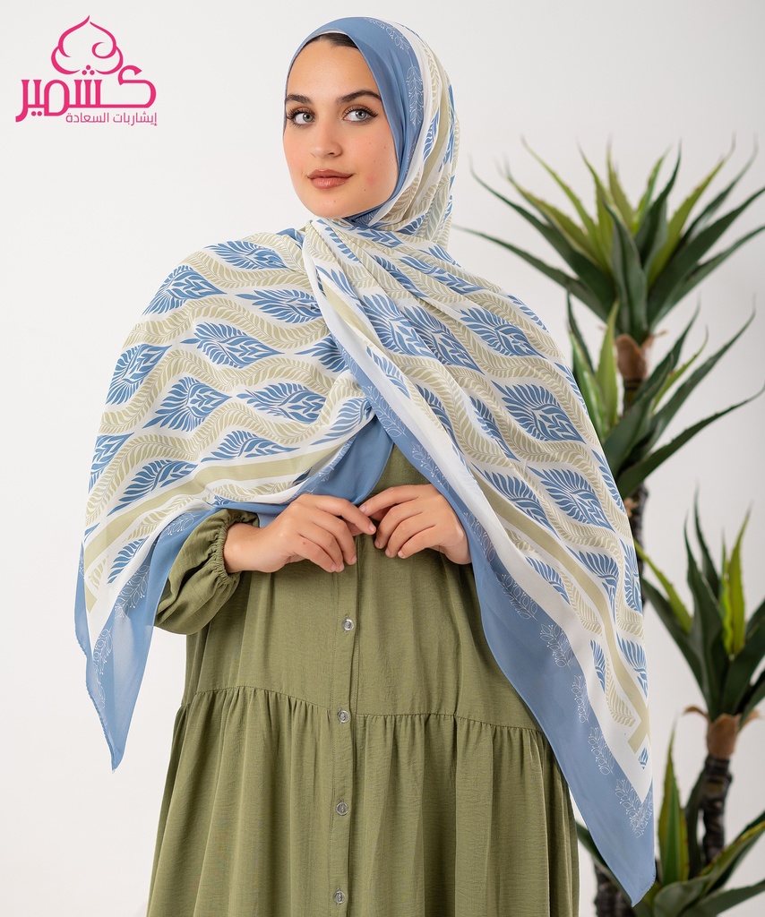 Scarf with a beige background and a leafy tree pattern in light blue 